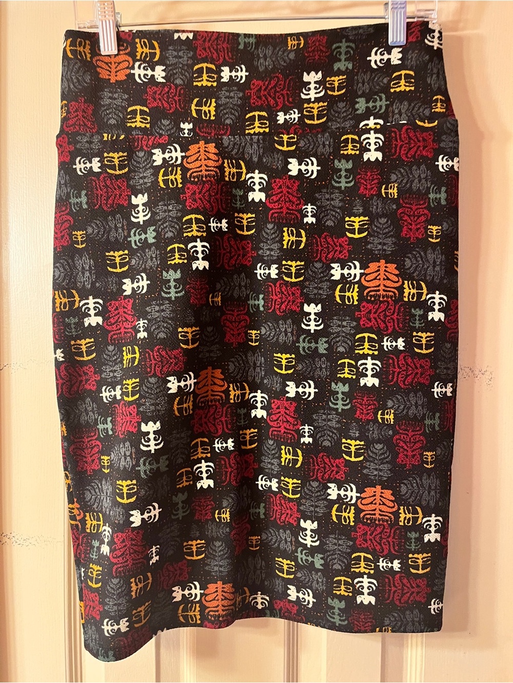 LuLaRoe Black Pencil Skirt with Red, Yellow, Orange, White & Green Motif